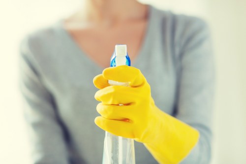 Professional carpet cleaner treating stained carpet in NW3