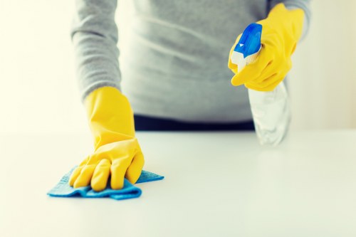 Local office cleaner preparing a workspace in NW3 for the next working day